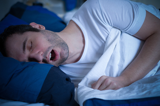 Man sleeping with mouth open from sleep apnea should go see Sleep Apnea Solutions of Cincinnati in Cincinnati, OH